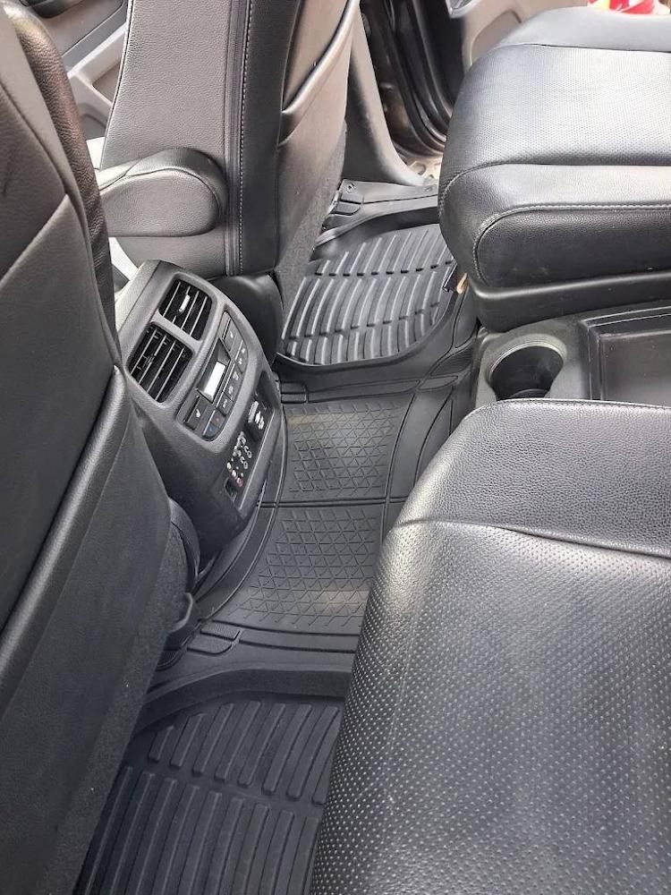 Rear footwell with detailed floor mats and clean air vents