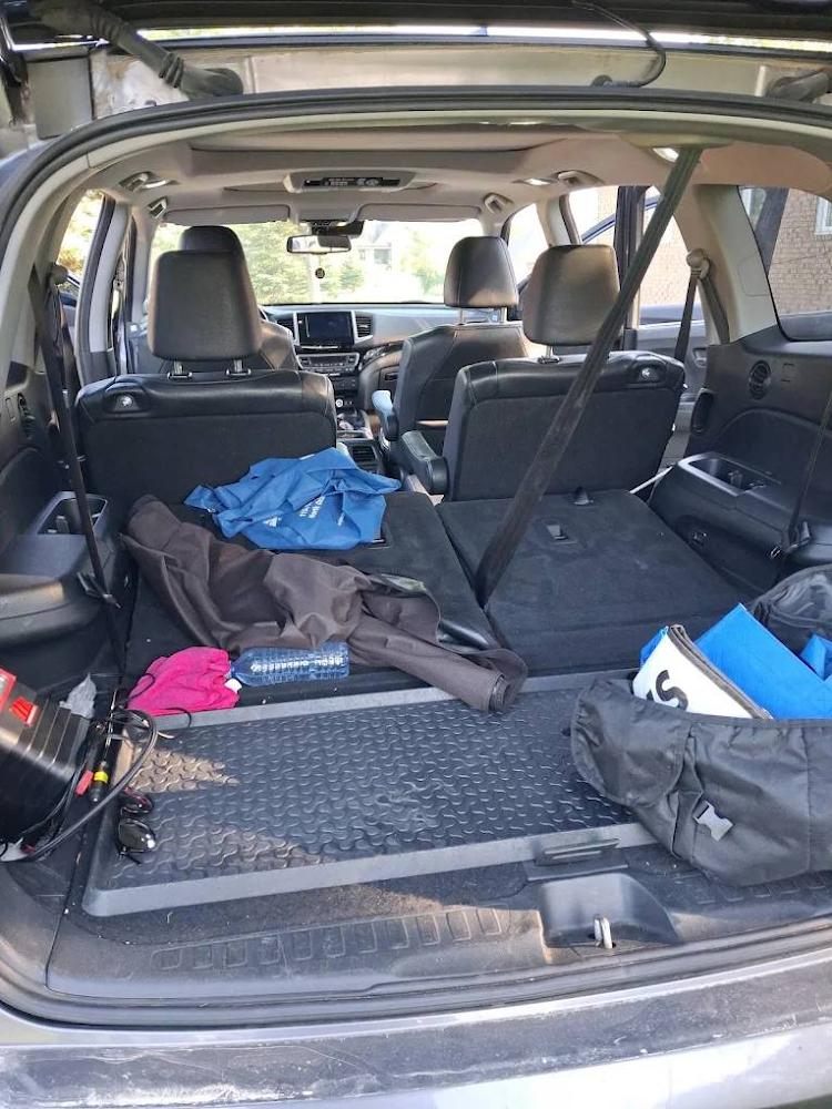 Loaded cargo area ready for the road after a detail